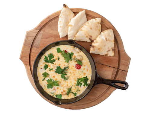 Запеченная курица с овощами ард сливочным соусом в  чугунке 